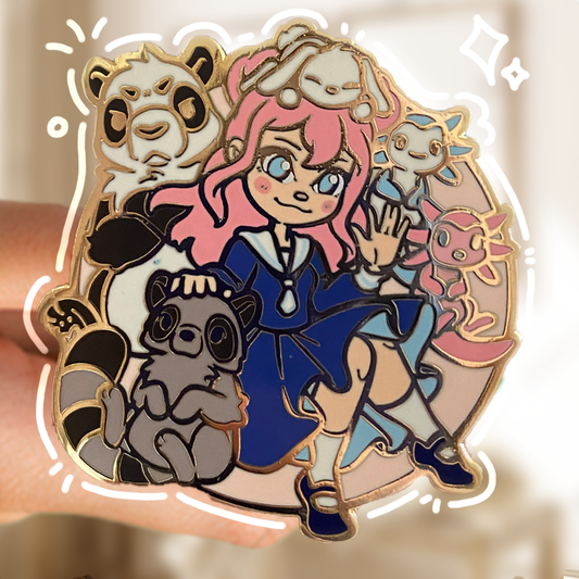 A gold metallic pin with coloured hard enamel featuring LDShadowLady character surrounded by critters (Panda, raccoon, bunny rabbit & axolotls)